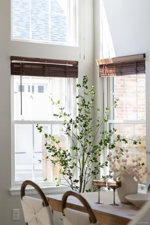 a view of a dining room with furniture and window