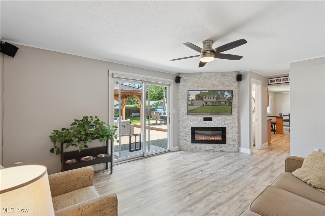 8191 Edgewood Road Mentor, OH 44060 - Photo 21 of 44 Comfort meets function in this updated family room with a gas fireplace and sliders that open to your private outdoor oasis