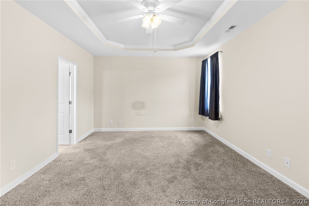 216 Meherrin Loop Raeford, NC 28376 - Photo 15 of 38 an empty room with a ceiling fan and window