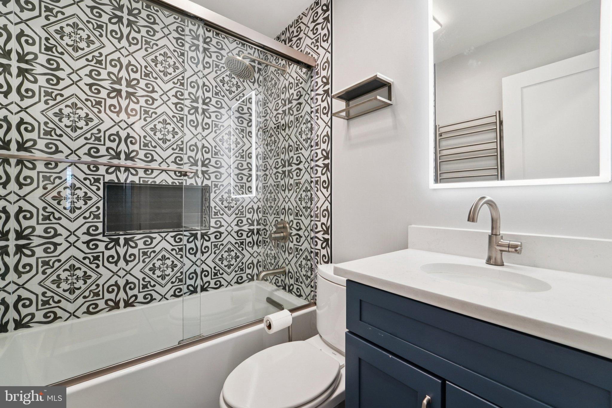 5 North Jefferson Street Frederick, MD 21701 - Photo 20 of 50 Stylish bathroom with bold tile accents.