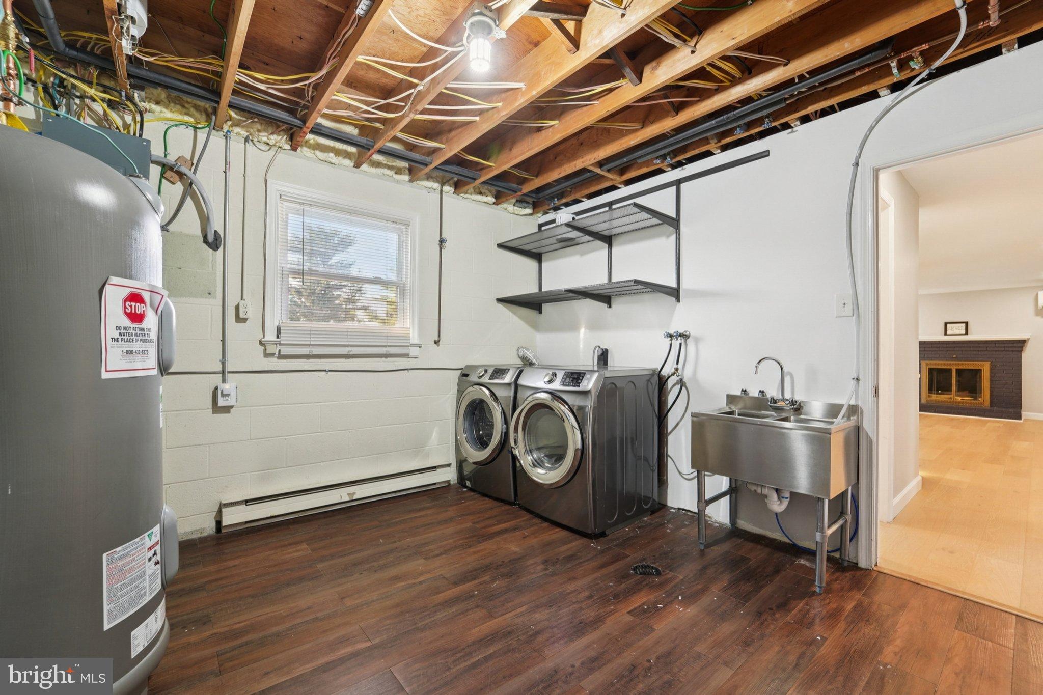 5 North Jefferson Street Frederick, MD 21701 - Photo 34 of 50 Spacious laundry area with modern appliances.