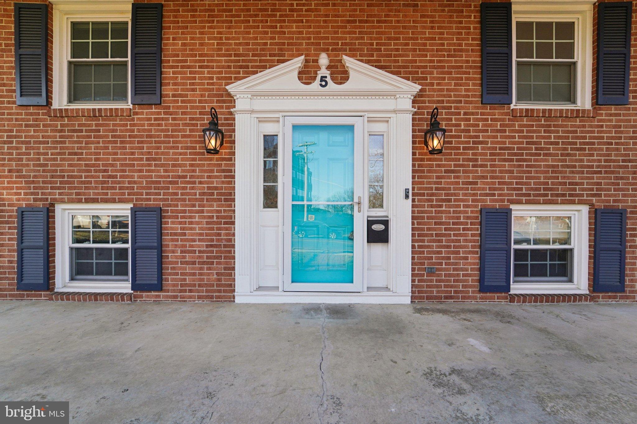 5 North Jefferson Street Frederick, MD 21701 - Photo 5 of 50 Charming brick facade with vibrant door.