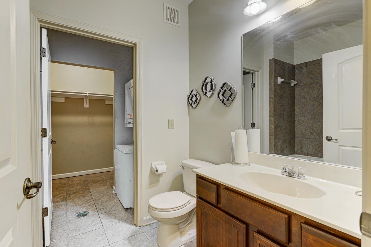 731 Litty Court, Unit 105 Memphis, TN 38103 - Photo 12 of 15 a bathroom with a sink and a mirror