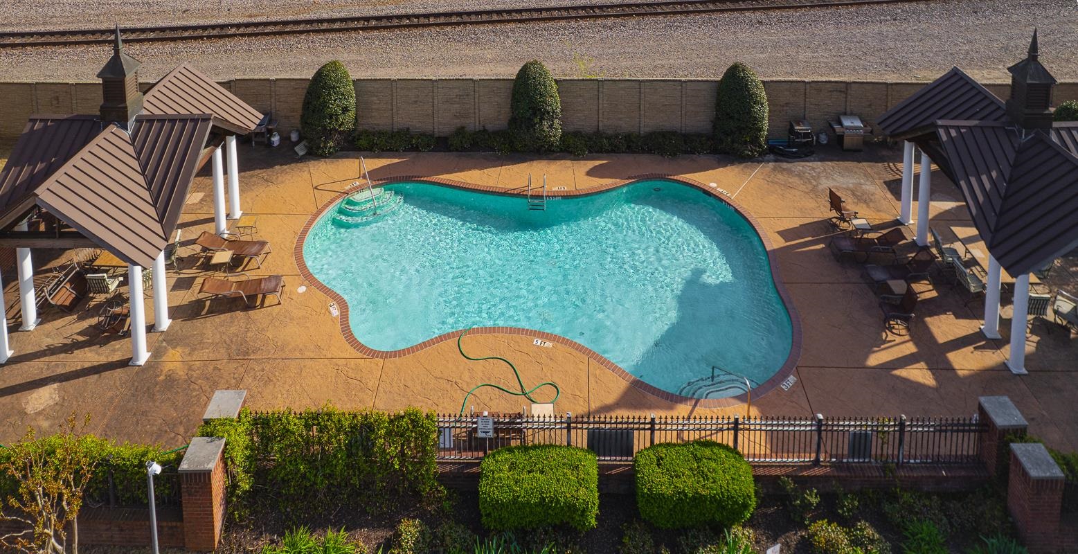 731 Litty Court, Unit 105 Memphis, TN 38103 - Photo 2 of 15 an aerial view of a house swimming pool patio and outdoor seating