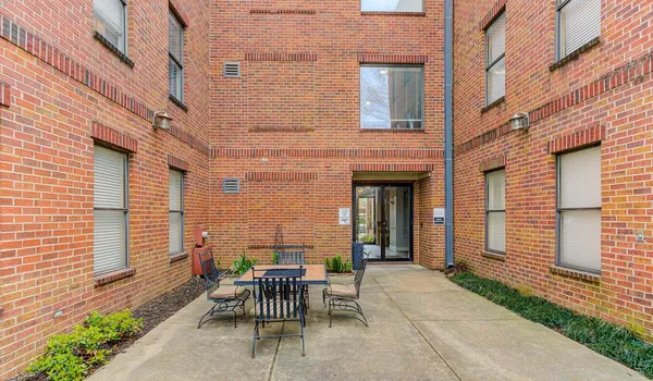 a view of a patio with a table and chairs in patio