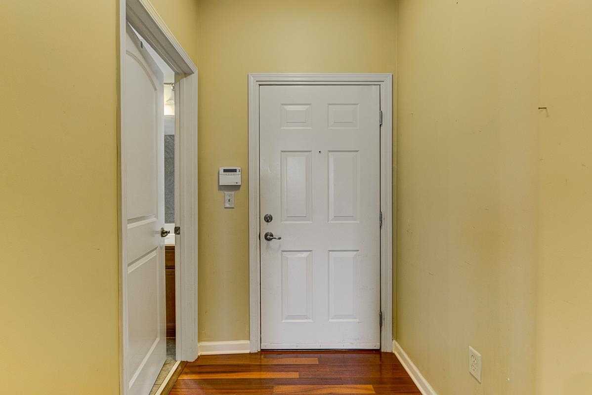 731 Litty Court, Unit 105 Memphis, TN 38103 - Photo 5 of 15 a view of front door with wooden floor