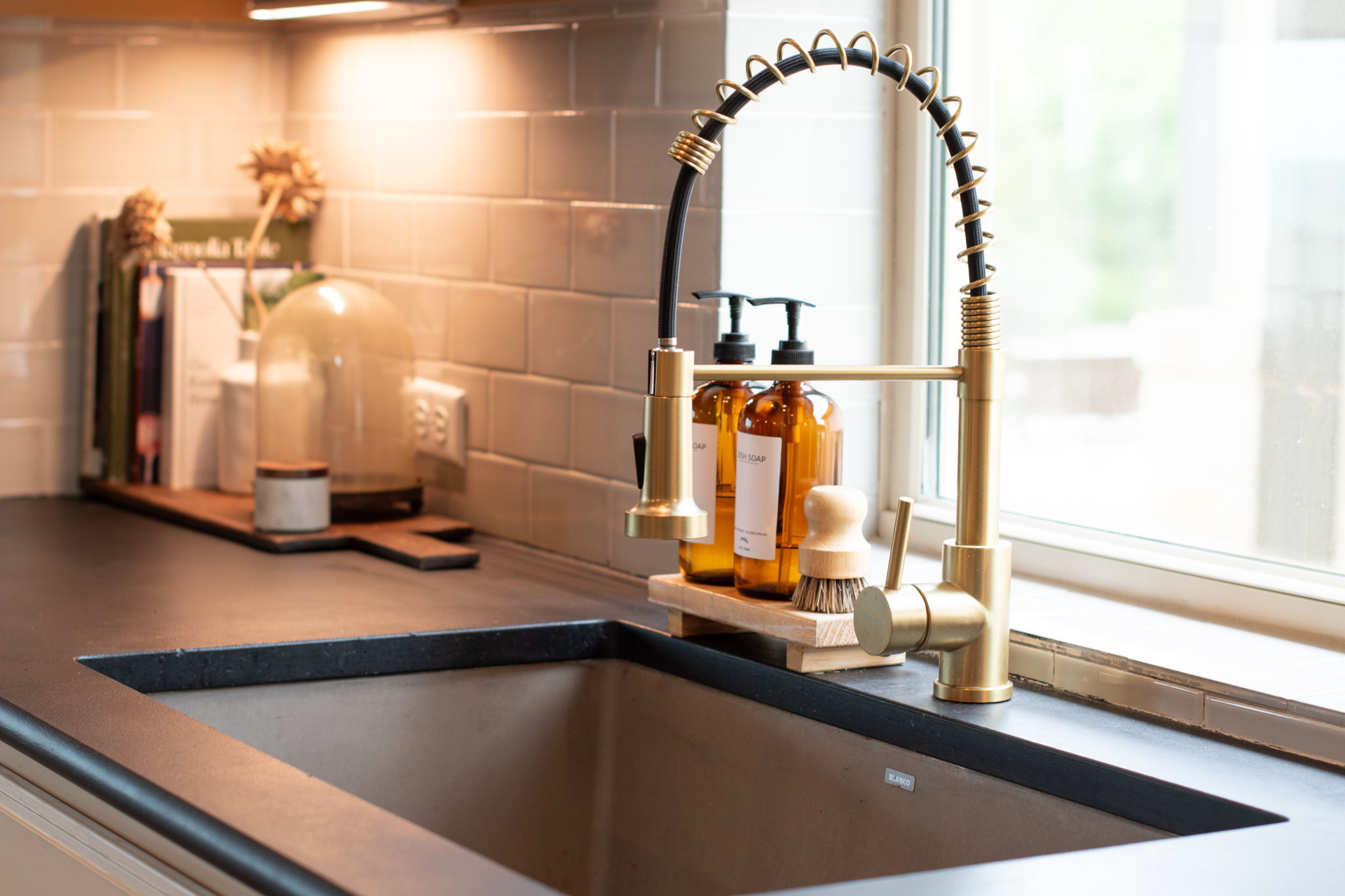 155 Balcones Ridge Way Bertram, TX 78605 - Photo 14 of 37 Modern kitchen sink with a stylish gold faucet.