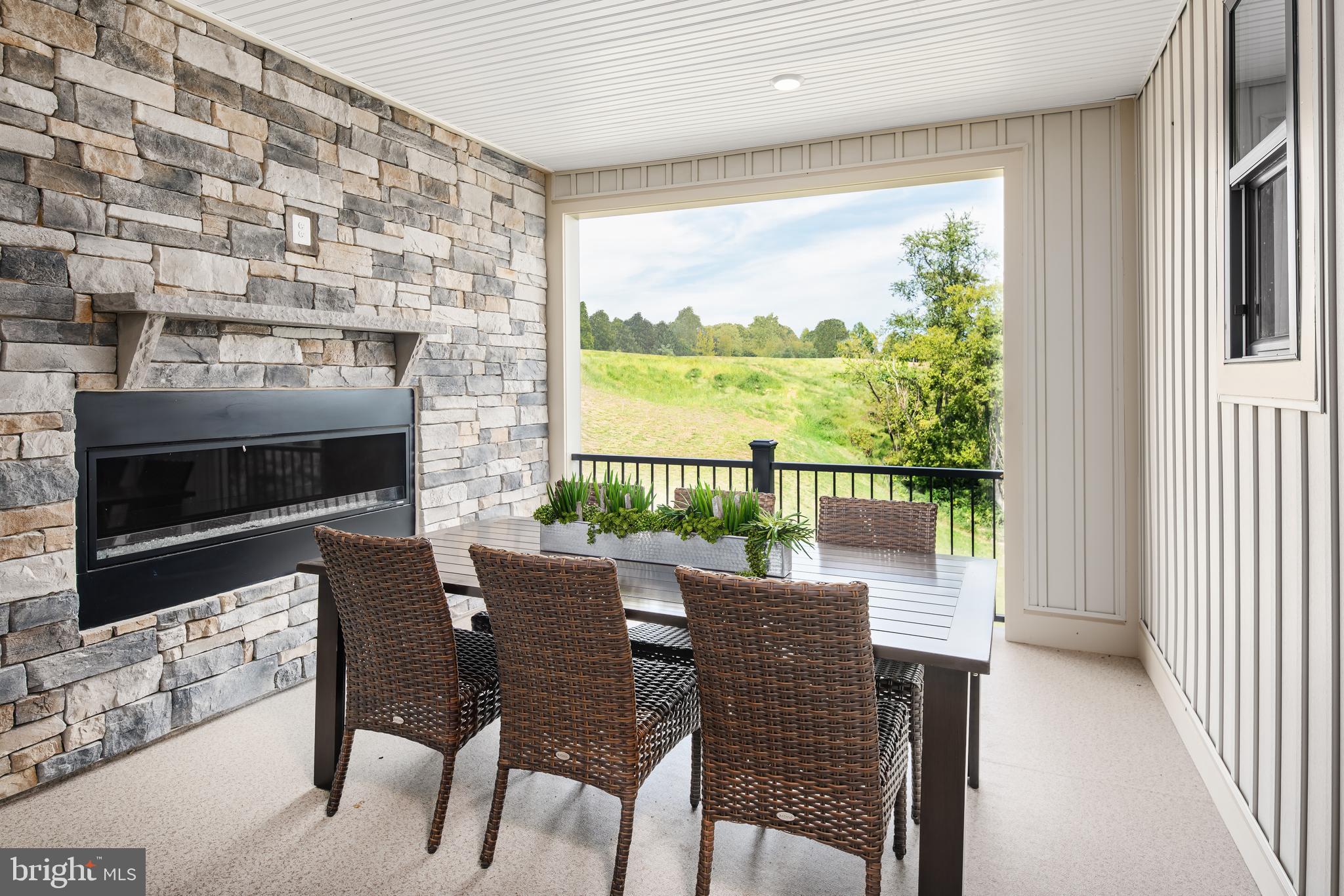 13818 Ridgeview Court Cockeysville, MD 21030 - Photo 10 of 16 a dining room with furniture a fireplace and wooden floor