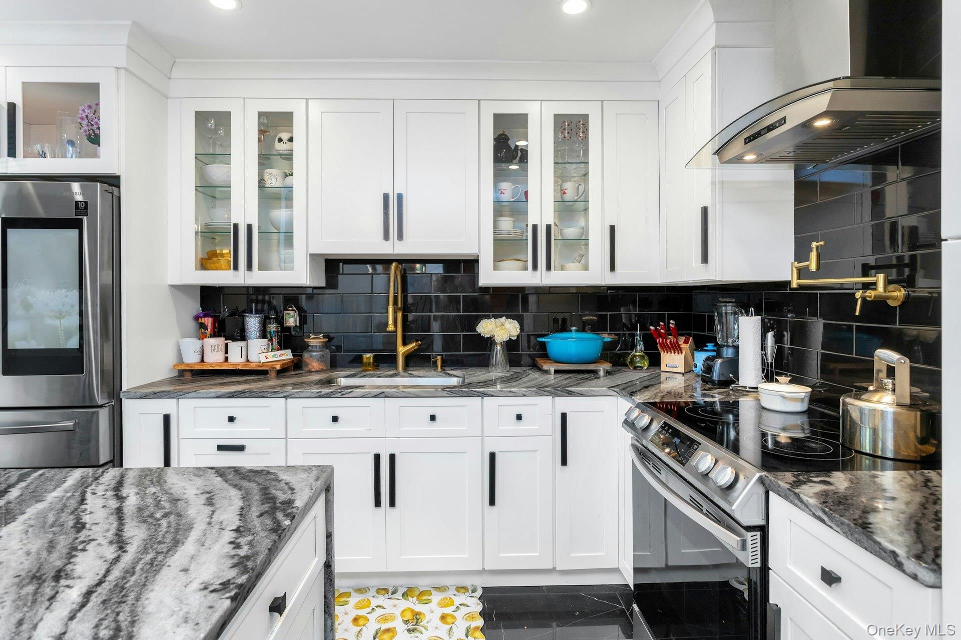 53 Villa Drive Peekskill, NY 10566 - Photo 12 of 26 a kitchen with granite countertop a sink and cabinets