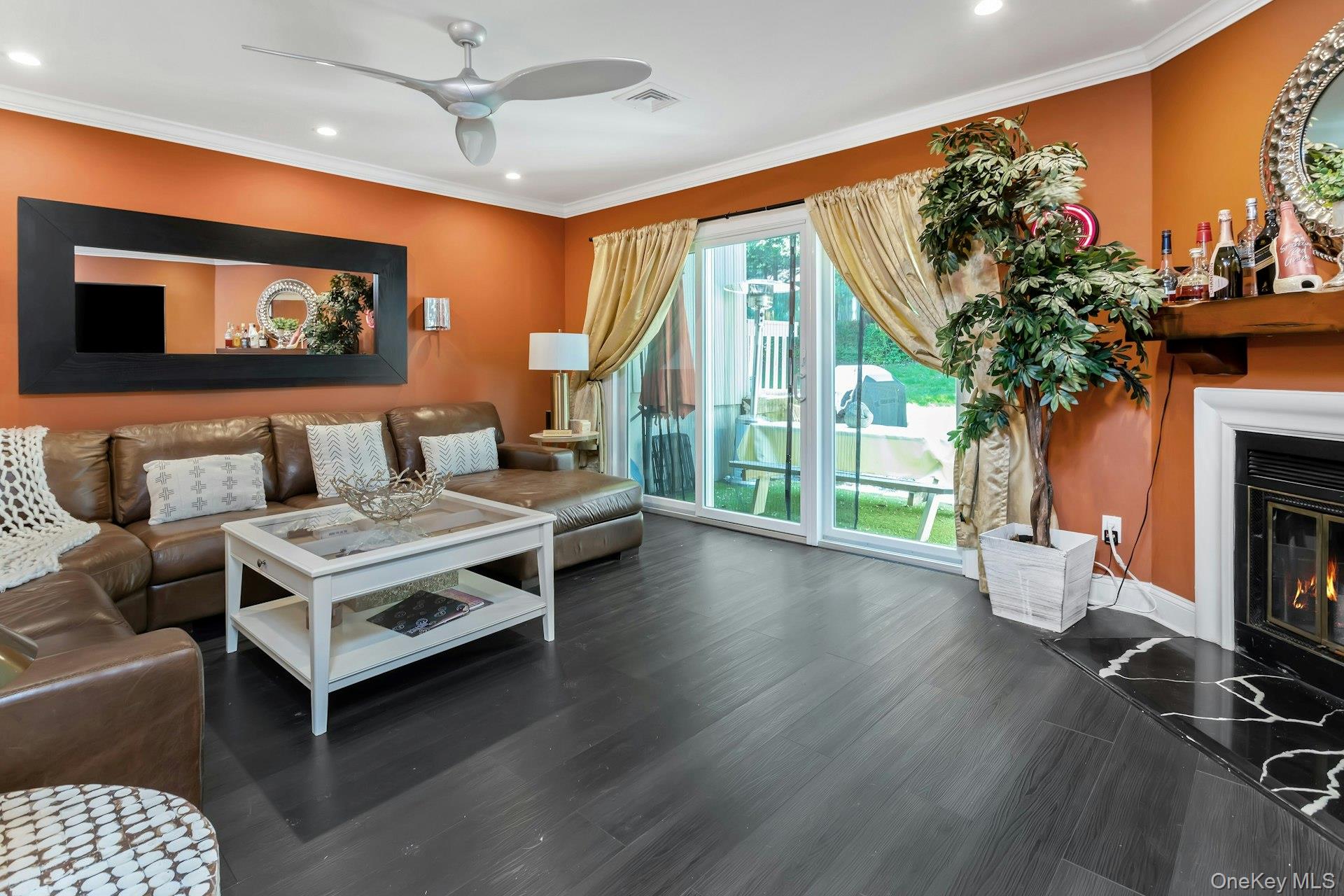 53 Villa Drive Peekskill, NY 10566 - Photo 6 of 26 a living room with furniture a large window and a fireplace