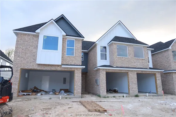 a front view of a house with yard