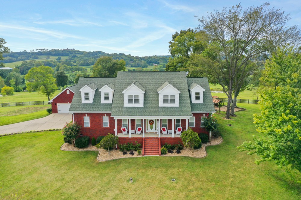 758 Sugar Flat Road Lebanon, TN 37087 - Photo 1 of 44 a front view of a house with a yard and garage