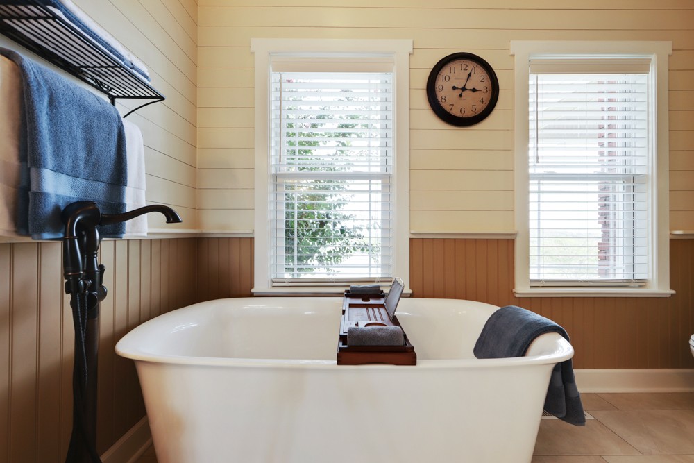758 Sugar Flat Road Lebanon, TN 37087 - Photo 13 of 44 a white bath tub sitting in a bathroom next to a window