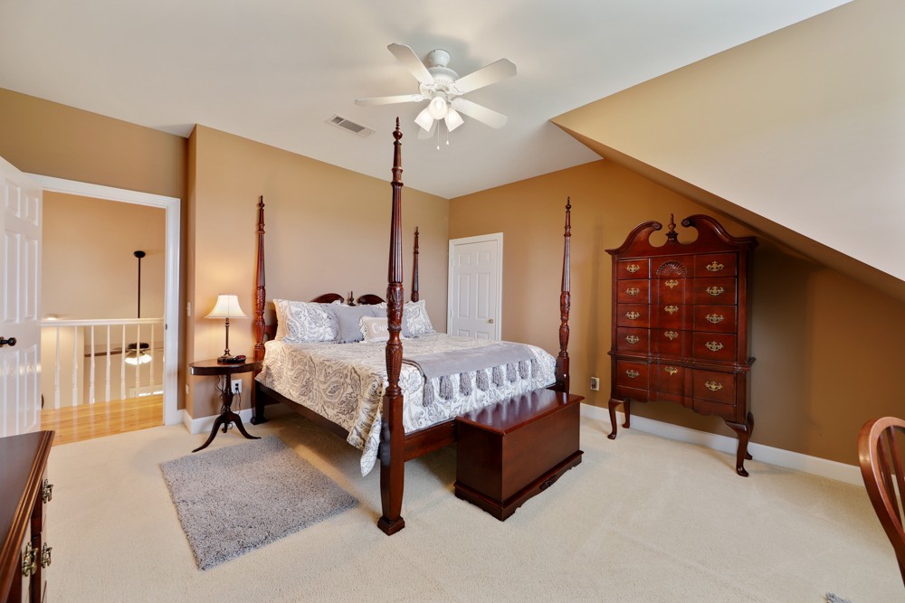 758 Sugar Flat Road Lebanon, TN 37087 - Photo 22 of 44 a bed room with a bed and a chair