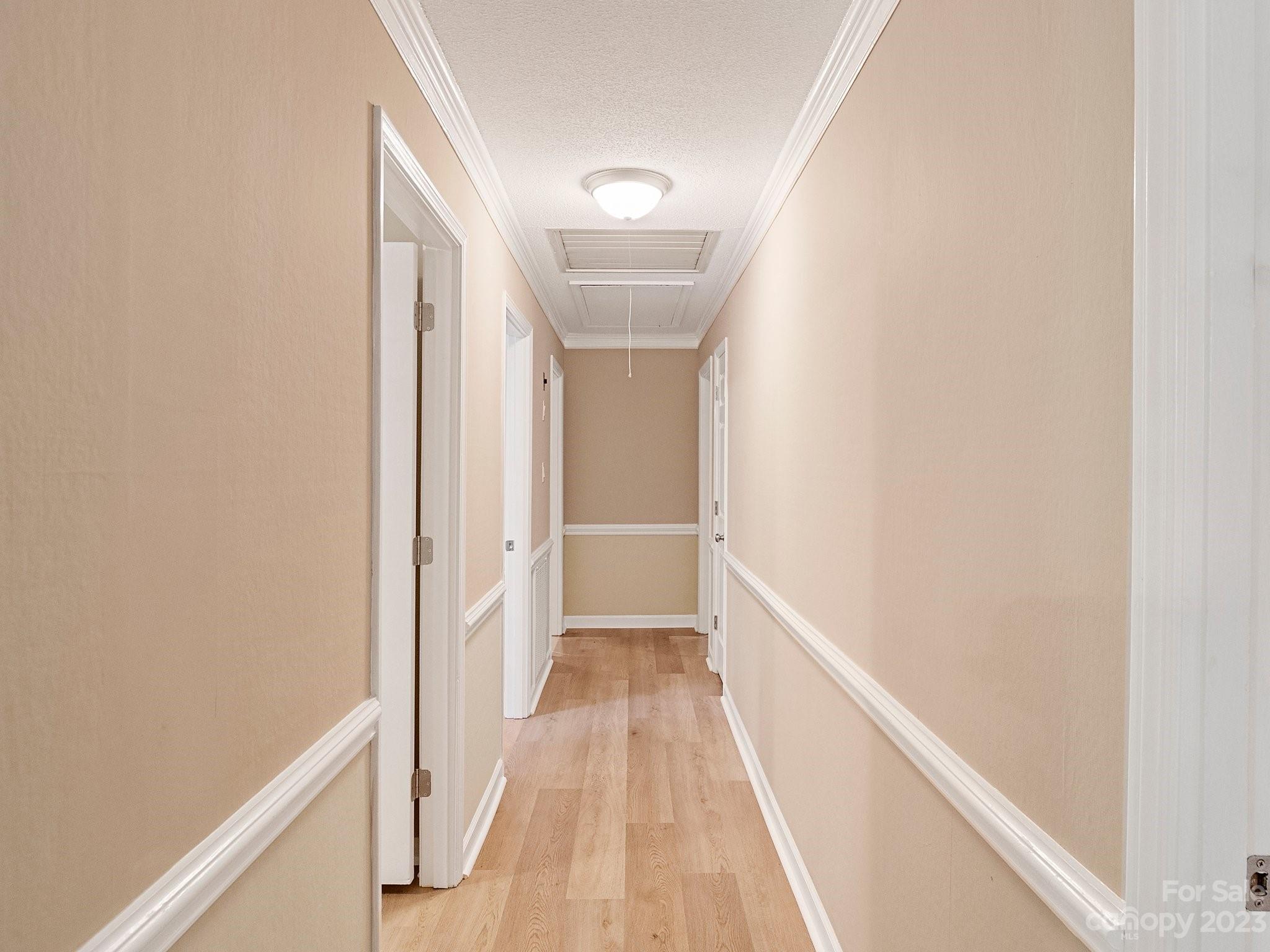 807 Red Cedar Lane Monroe, NC 28110 - Photo 19 of 34 a view of a hallway with wooden floor
