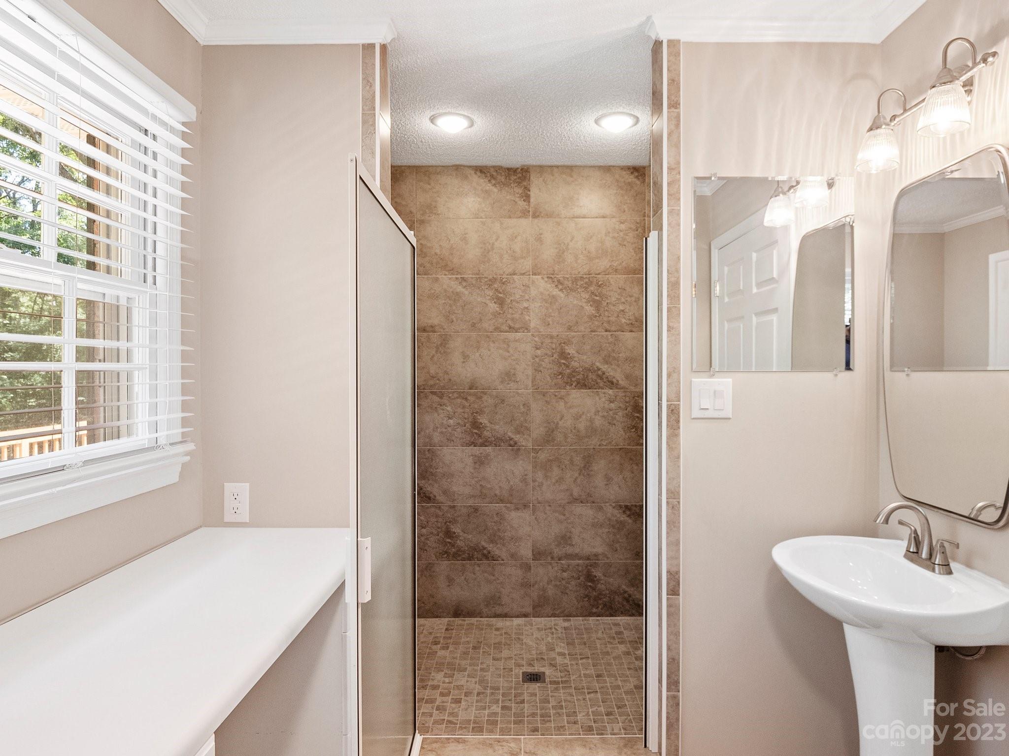 807 Red Cedar Lane Monroe, NC 28110 - Photo 27 of 34 a bathroom with a sink a toilet and shower