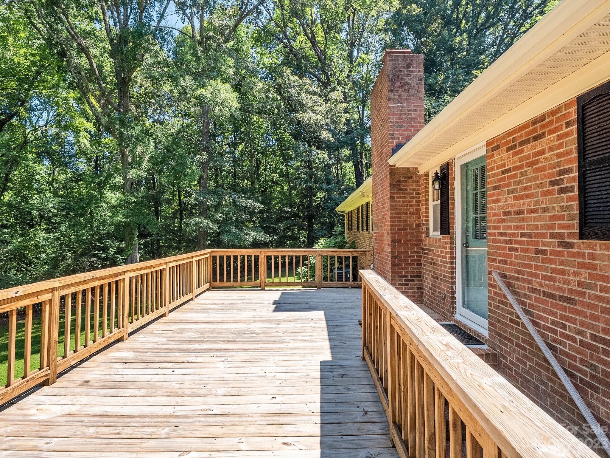 807 Red Cedar Lane Monroe, NC 28110 - Photo 30 of 34 a view of balcony with wooden floor and fence