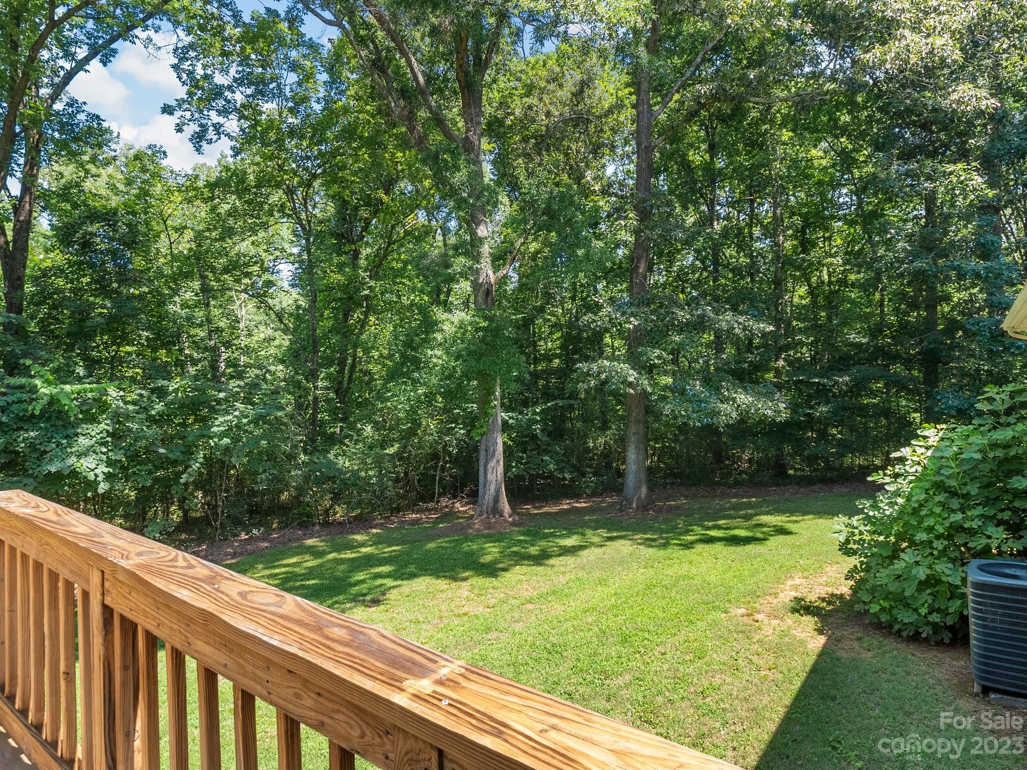 807 Red Cedar Lane Monroe, NC 28110 - Photo 31 of 34 a view of a yard with large trees