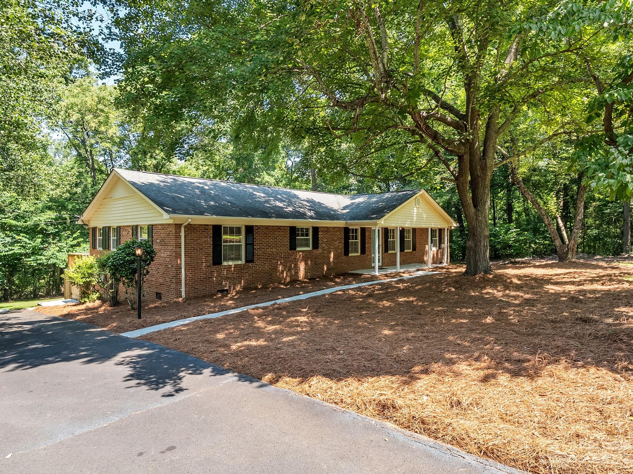 807 Red Cedar Lane Monroe, NC 28110 - Photo 4 of 34 a front view of a house with a yard