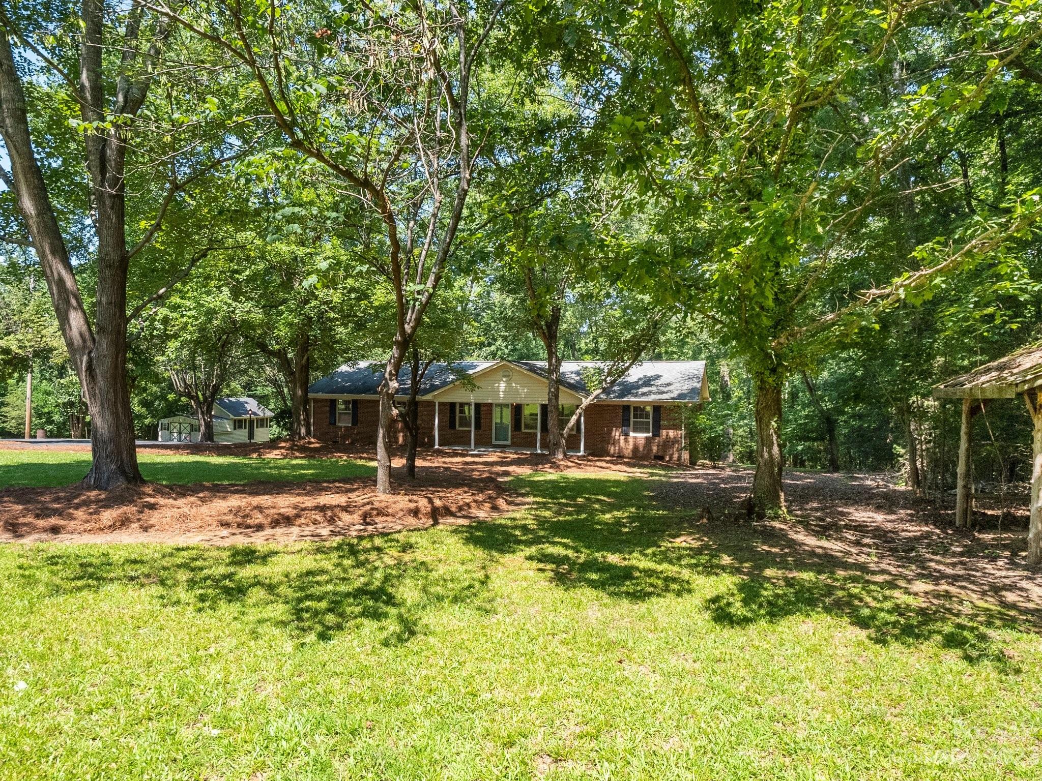 807 Red Cedar Lane Monroe, NC 28110 - Photo 5 of 34 a white house that has tree in front of it