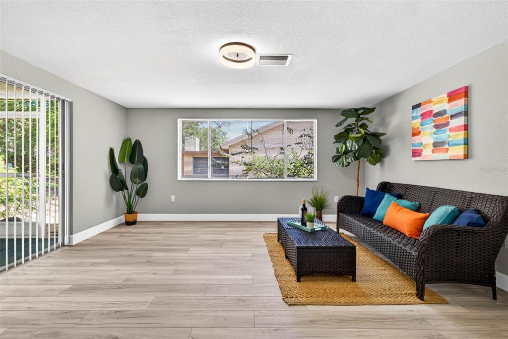 12415 Stagecoach Lane Hudson, FL 34667 - Photo 17 of 51 a living room with furniture and a window