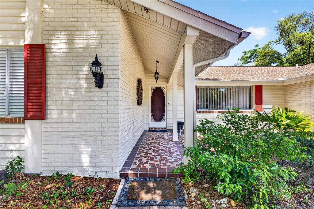 12415 Stagecoach Lane Hudson, FL 34667 - Photo 2 of 51 a view of a house with a porch