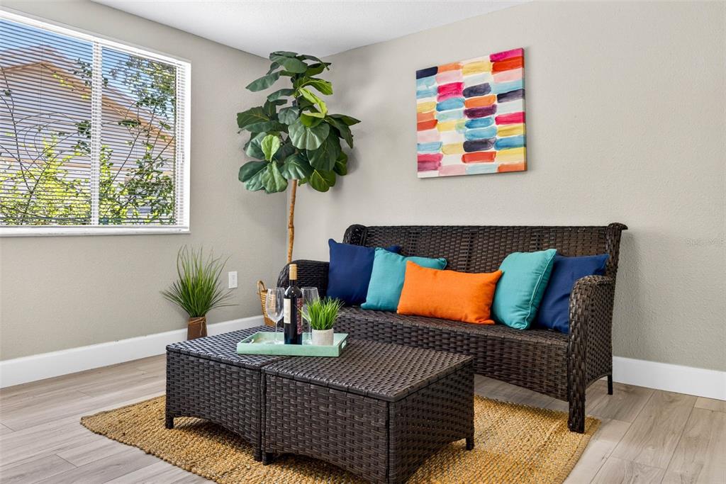 12415 Stagecoach Lane Hudson, FL 34667 - Photo 21 of 51 a living room with furniture and a potted plant