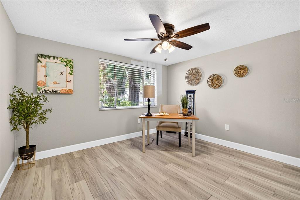 12415 Stagecoach Lane Hudson, FL 34667 - Photo 22 of 51 a view of a workspace with furniture and a window