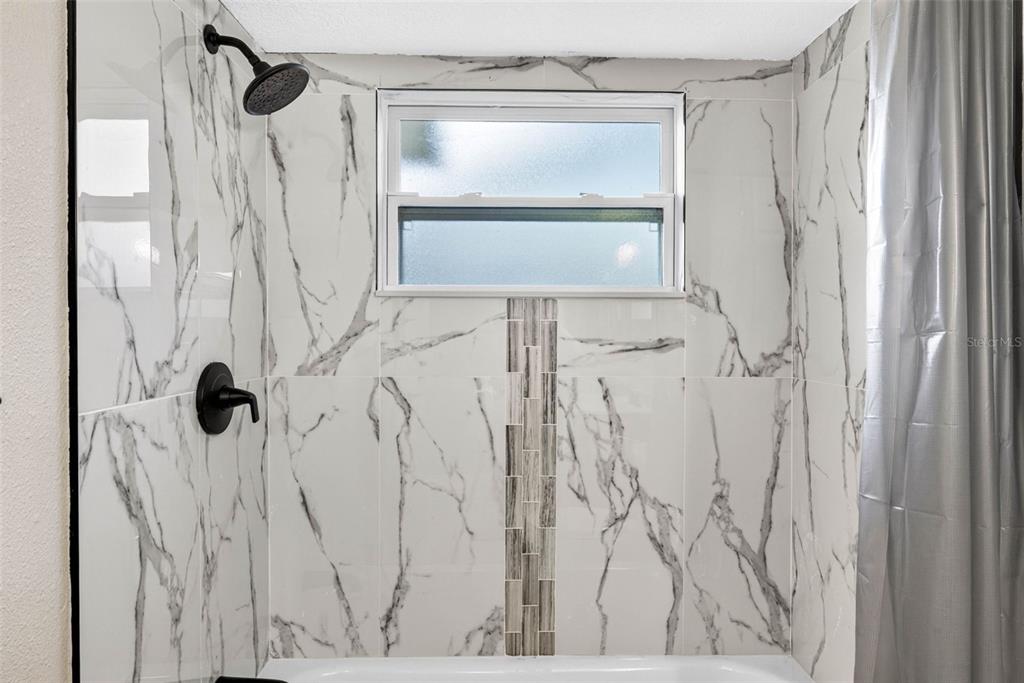 12415 Stagecoach Lane Hudson, FL 34667 - Photo 25 of 51 a bathroom with a shower