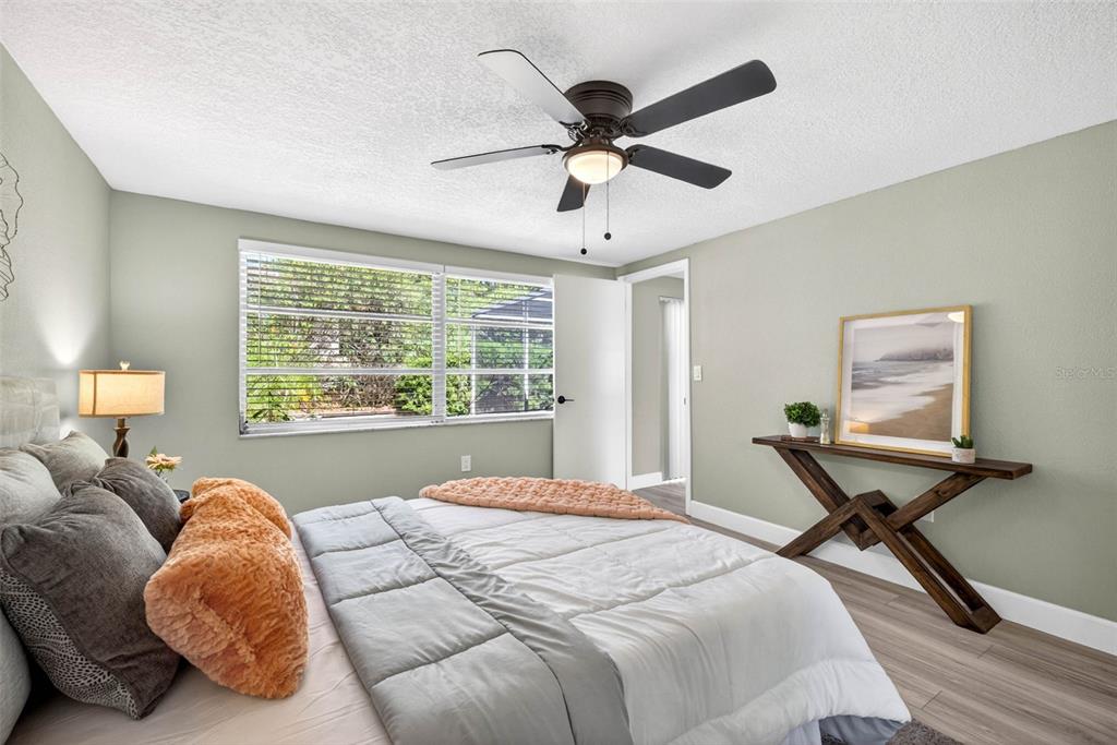 12415 Stagecoach Lane Hudson, FL 34667 - Photo 27 of 51 a bedroom with a bed and window