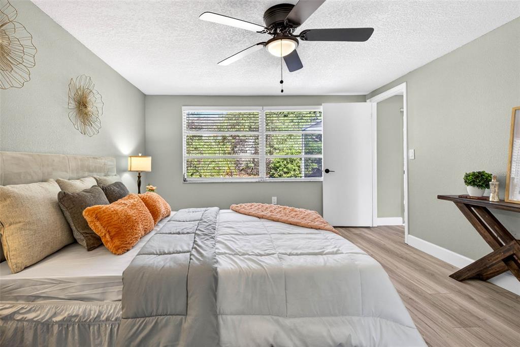 12415 Stagecoach Lane Hudson, FL 34667 - Photo 28 of 51 a bedroom with a bed and a window