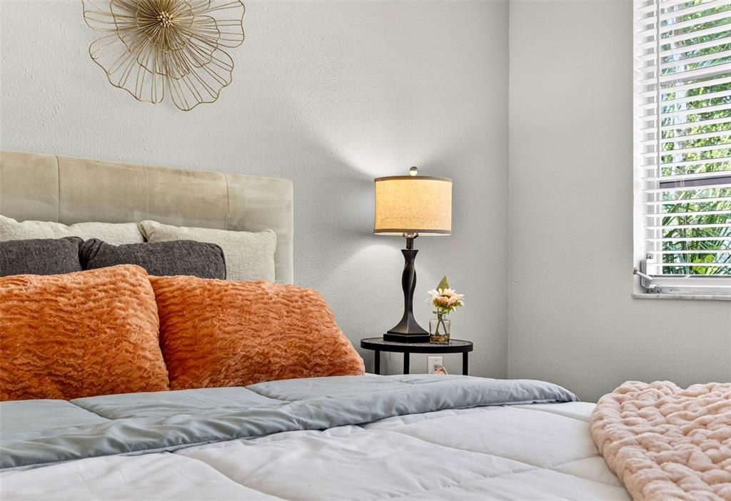 12415 Stagecoach Lane Hudson, FL 34667 - Photo 29 of 51 a bedroom with a bed and couch