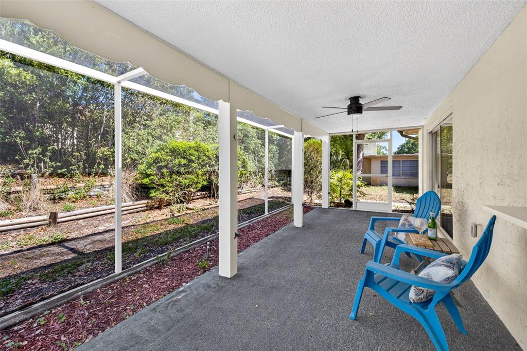 12415 Stagecoach Lane Hudson, FL 34667 - Photo 33 of 51 a room with furniture and a large window