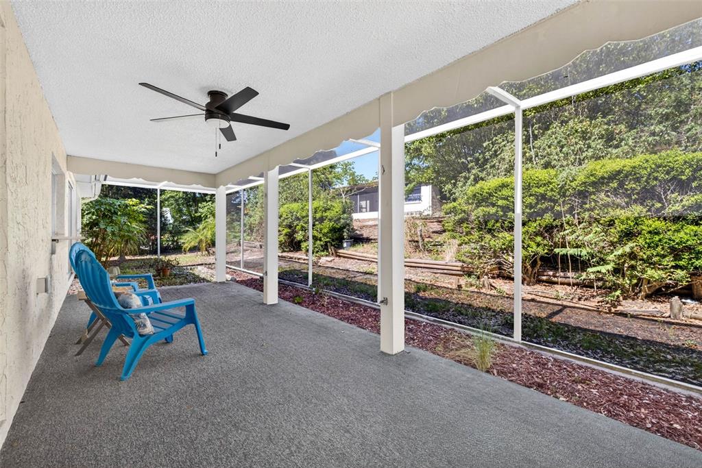 12415 Stagecoach Lane Hudson, FL 34667 - Photo 35 of 51 a living room with wooden floor and furniture