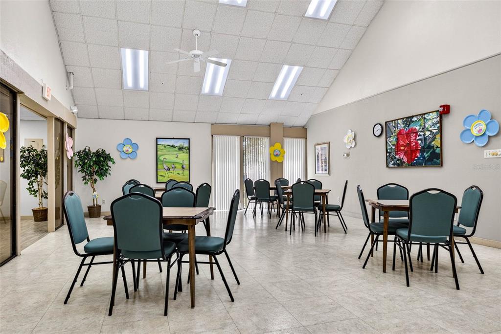 12415 Stagecoach Lane Hudson, FL 34667 - Photo 41 of 51 a dining room with furniture and a floor to ceiling window