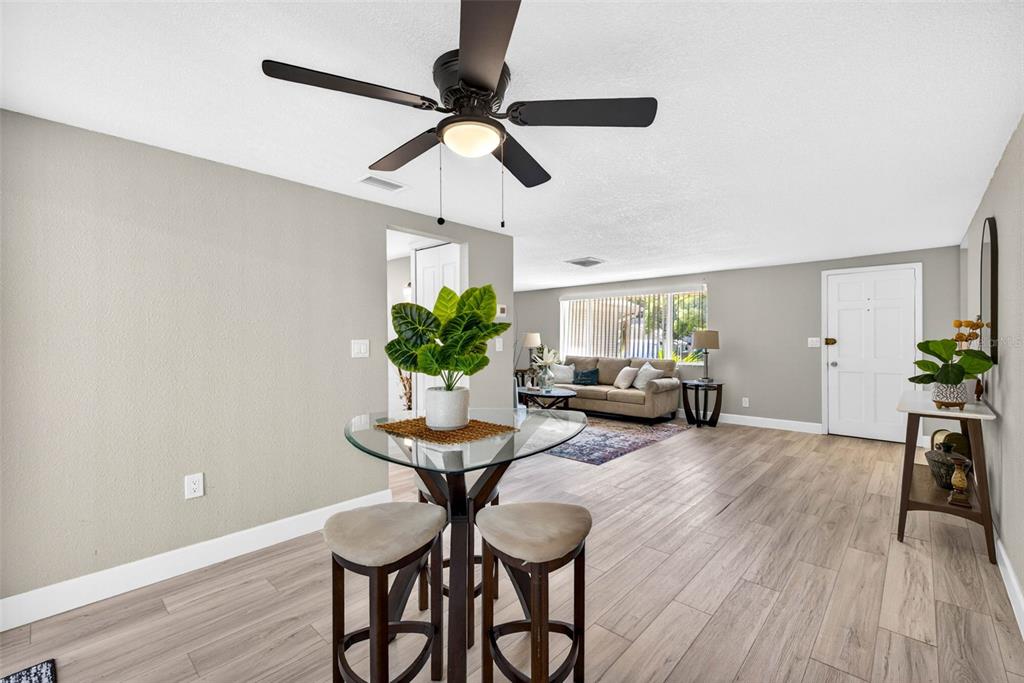 12415 Stagecoach Lane Hudson, FL 34667 - Photo 8 of 51 a living room with furniture and a wooden floor
