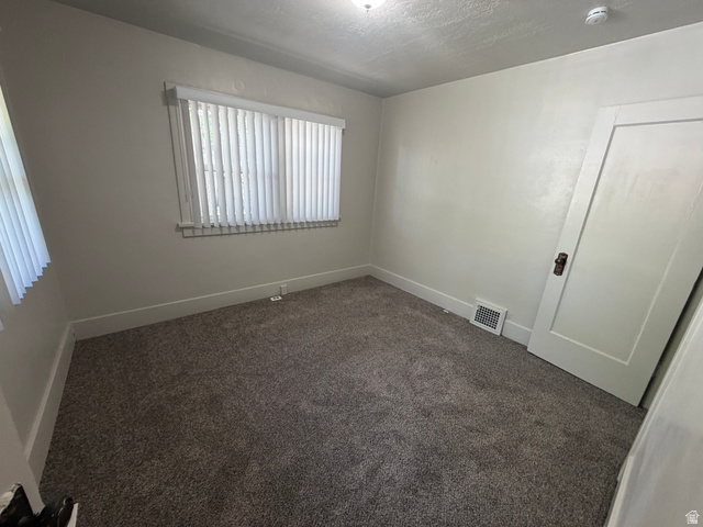 2205 East 3300 South Millcreek, UT 84109 - Photo 17 of 23 Room featuring light gray carpet flooring and white painted walls