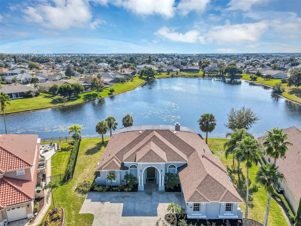 3728 Hunter's Isle Drive Orlando, FL 32837 - Photo 3 of 74 a view of a lake with a mountain in the background