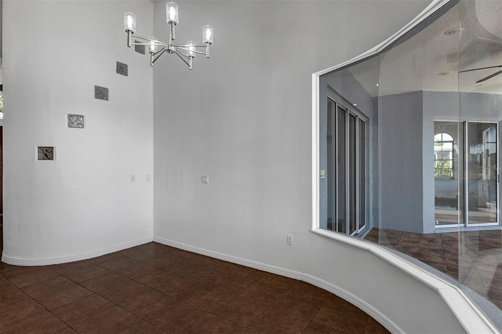 3728 Hunter's Isle Drive Orlando, FL 32837 - Photo 31 of 74 a view of a livingroom with a ceiling fan and window