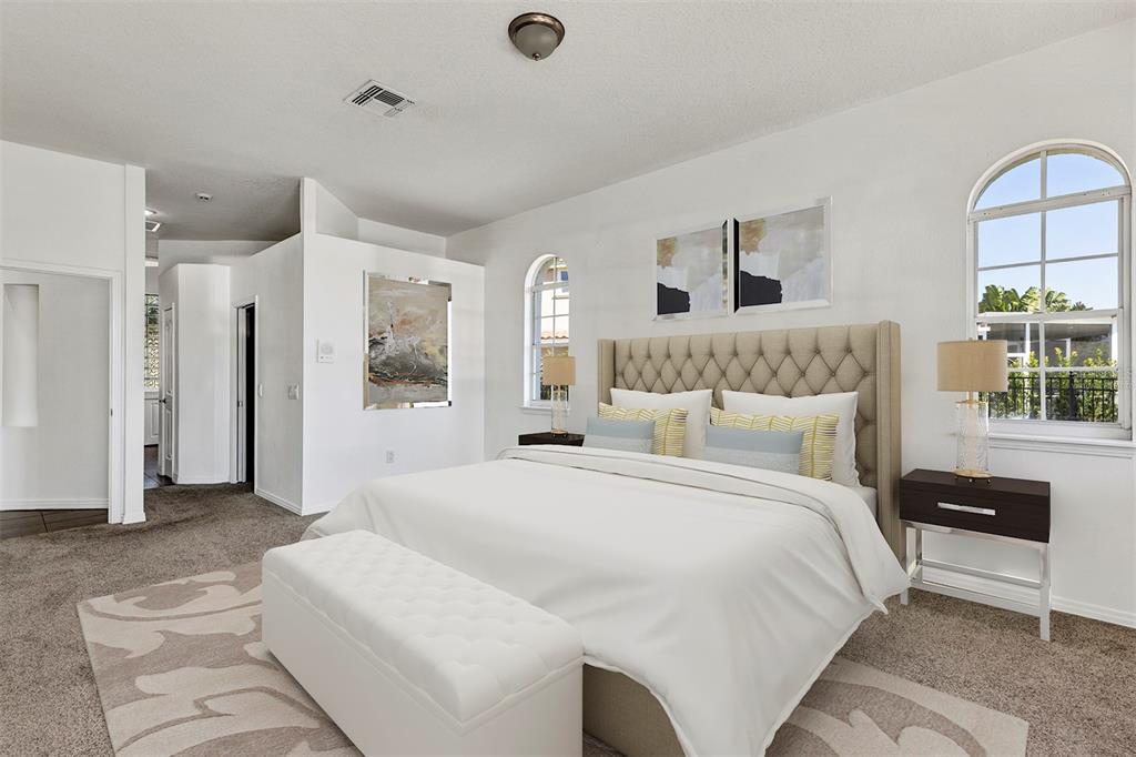 3728 Hunter's Isle Drive Orlando, FL 32837 - Photo 38 of 74 a large white bed in a white room