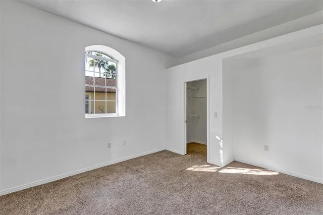 a view of a living room and floor to ceiling window