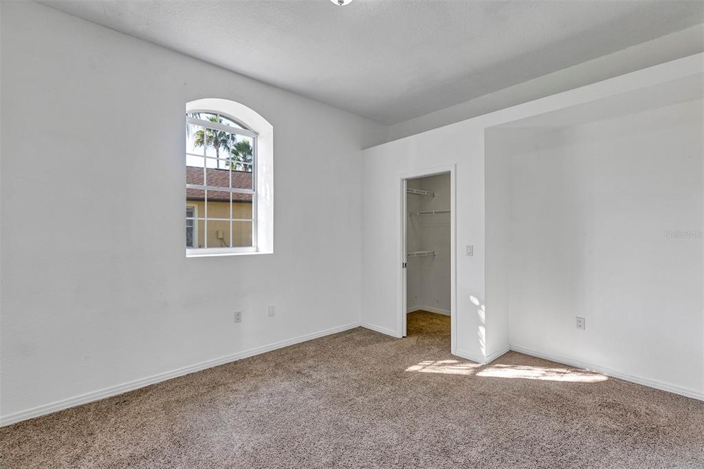 3728 Hunter's Isle Drive Orlando, FL 32837 - Photo 46 of 74 an empty room with windows