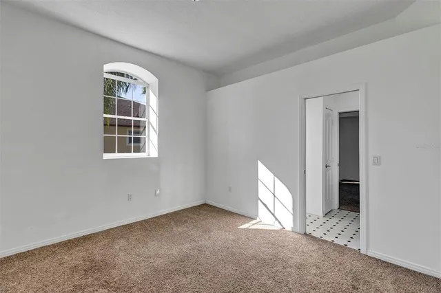 aerial view of a house with a garden and lake view