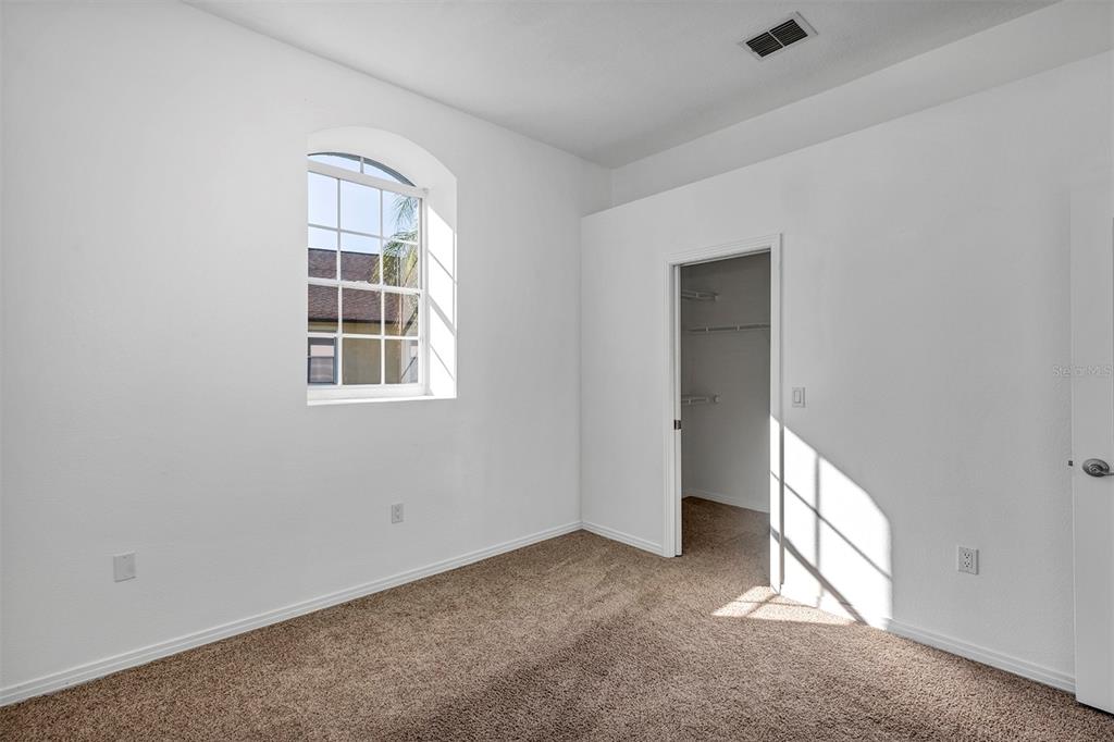 3728 Hunter's Isle Drive Orlando, FL 32837 - Photo 49 of 74 an empty room with windows