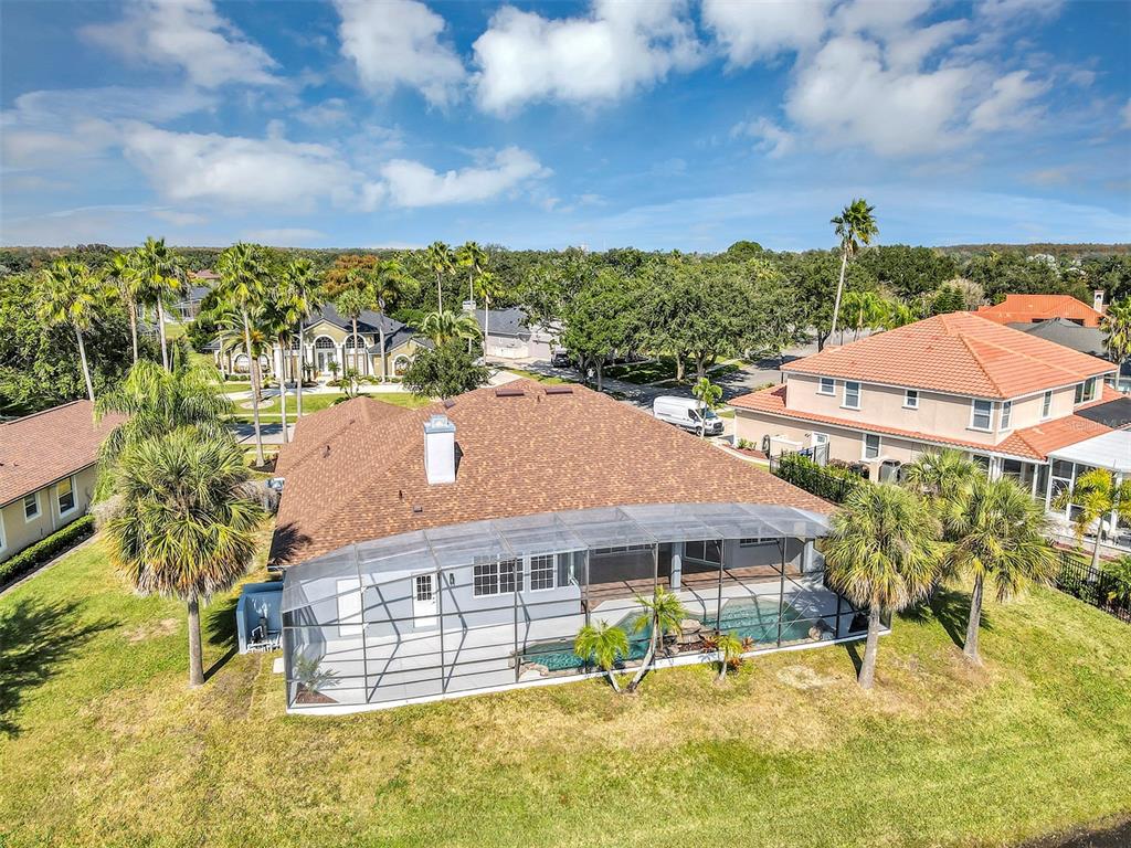3728 Hunter's Isle Drive Orlando, FL 32837 - Photo 73 of 74 a view of a house with a yard and sitting area
