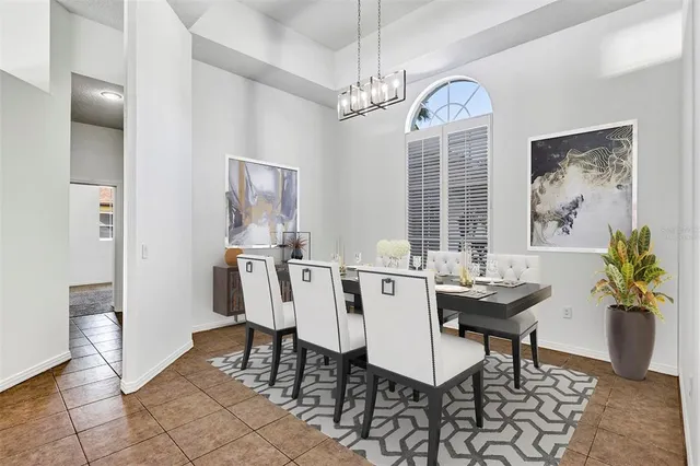 an empty room with a ceiling fan and carpet