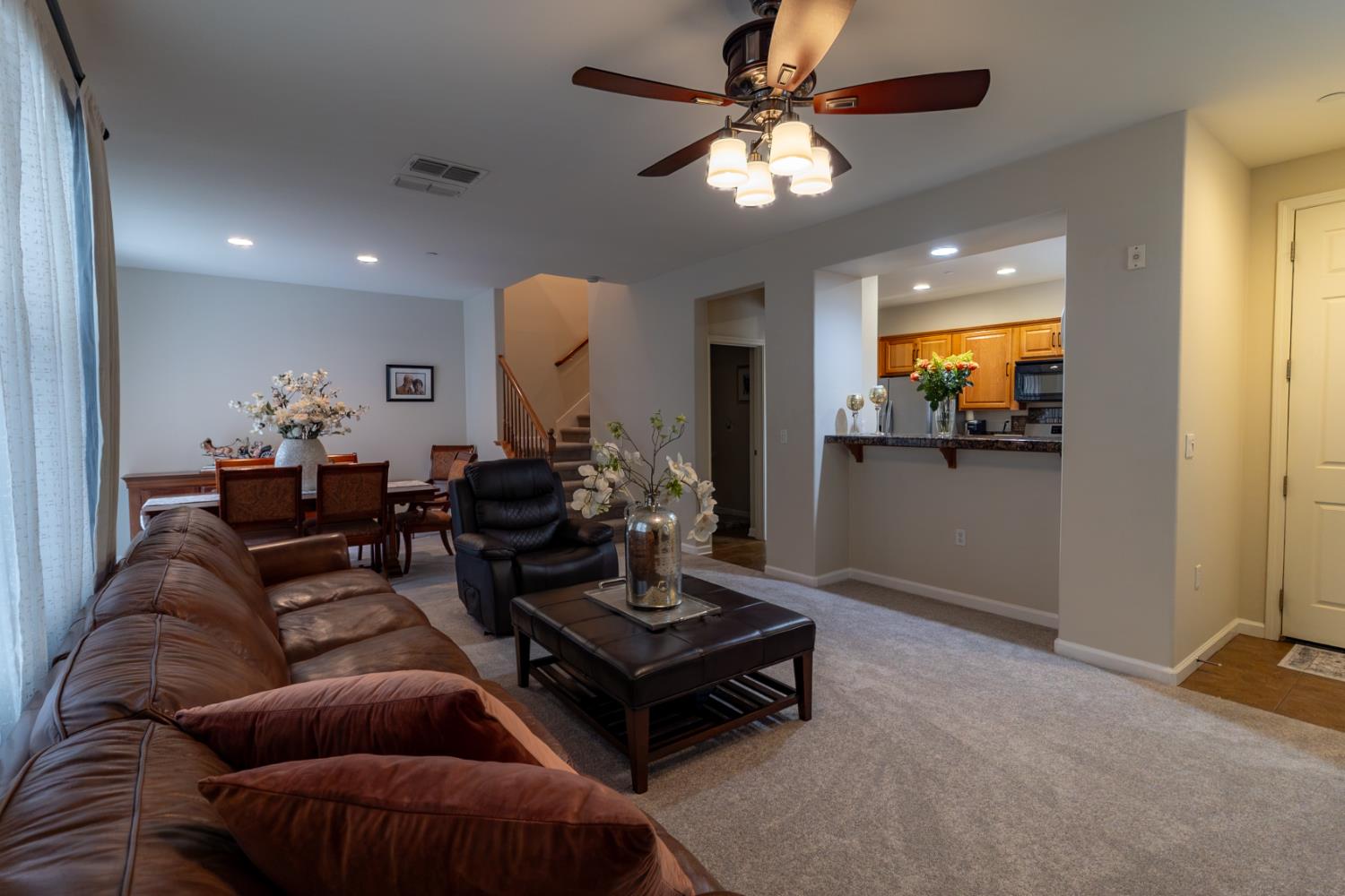401 Picasso Way Folsom, CA 95630 - Photo 4 of 32 a living room with furniture and a chandelier