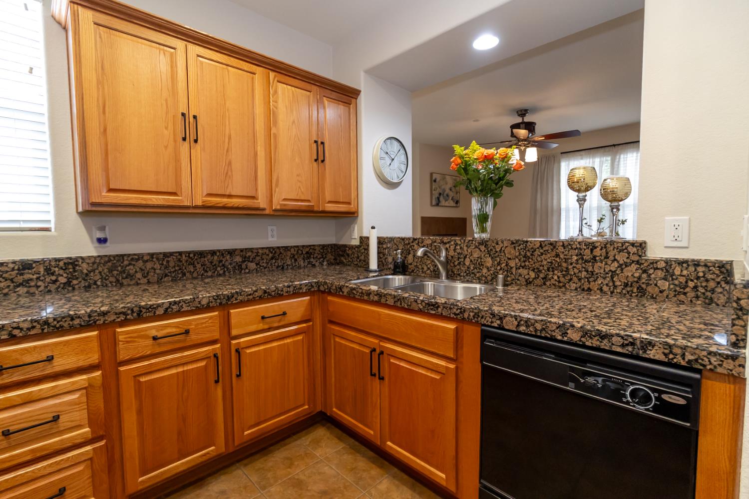 401 Picasso Way Folsom, CA 95630 - Photo 6 of 32 a kitchen with granite countertop a sink and cabinets