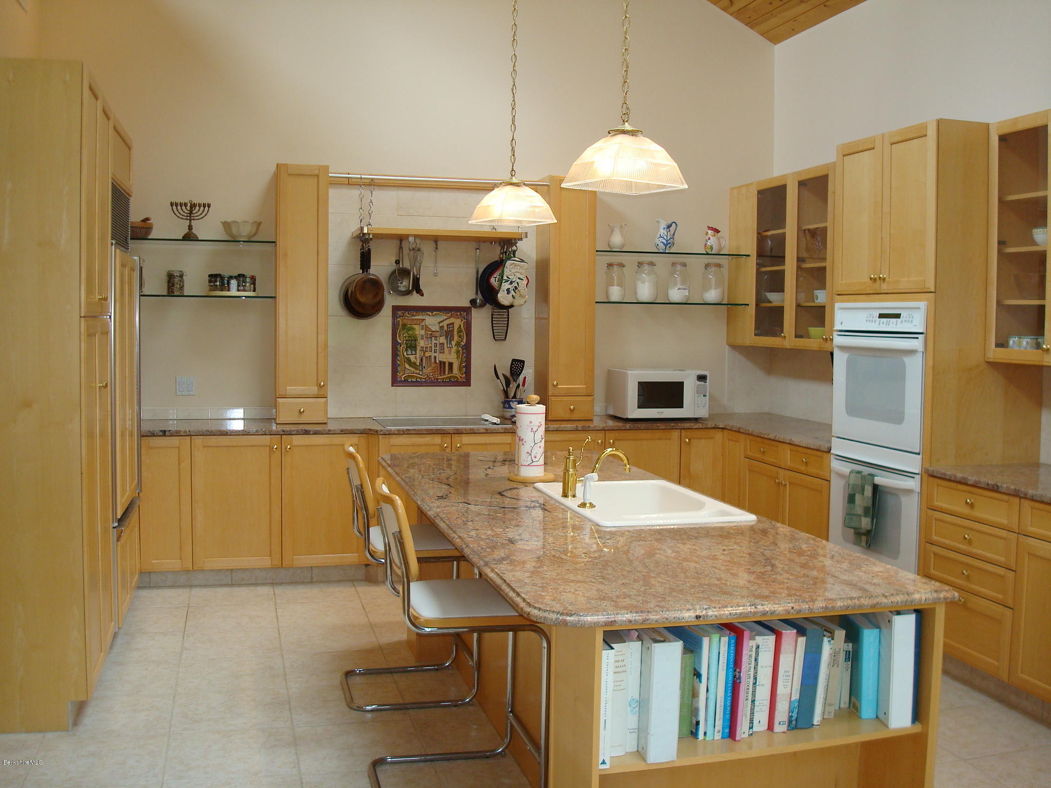 1151 E Road Richmond, MA 01254 - Photo 16 of 33 a kitchen with kitchen island granite countertop a sink cabinets and stainless steel appliances