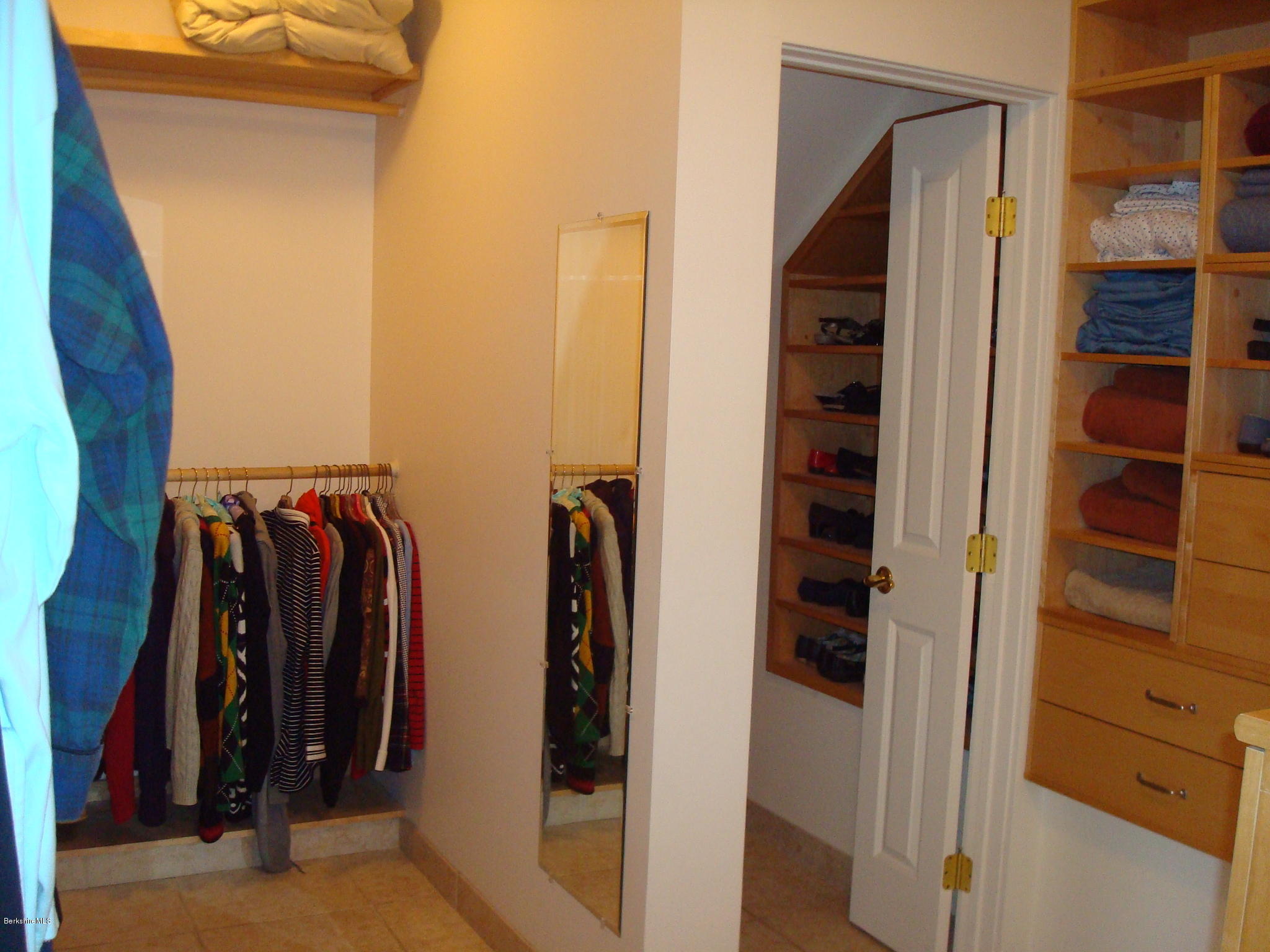 1151 E Road Richmond, MA 01254 - Photo 20 of 33 a view of walk in closet with clothes and shoes